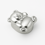 Sterling silver teddy bear pillbox on white background, polished finish, bowtie detail.