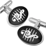 Detailed view of Sterling Silver Treble Clef cufflink showing raised staff lines and glossy enamel finish by Ari D Norman