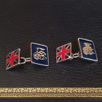 Sterling silver cufflink shown from a front angle, highlighting enamel detail and polished finish.