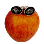Black enamel Treble Clef cufflinks styled on a red apple, emphasizing polish and musical elegance