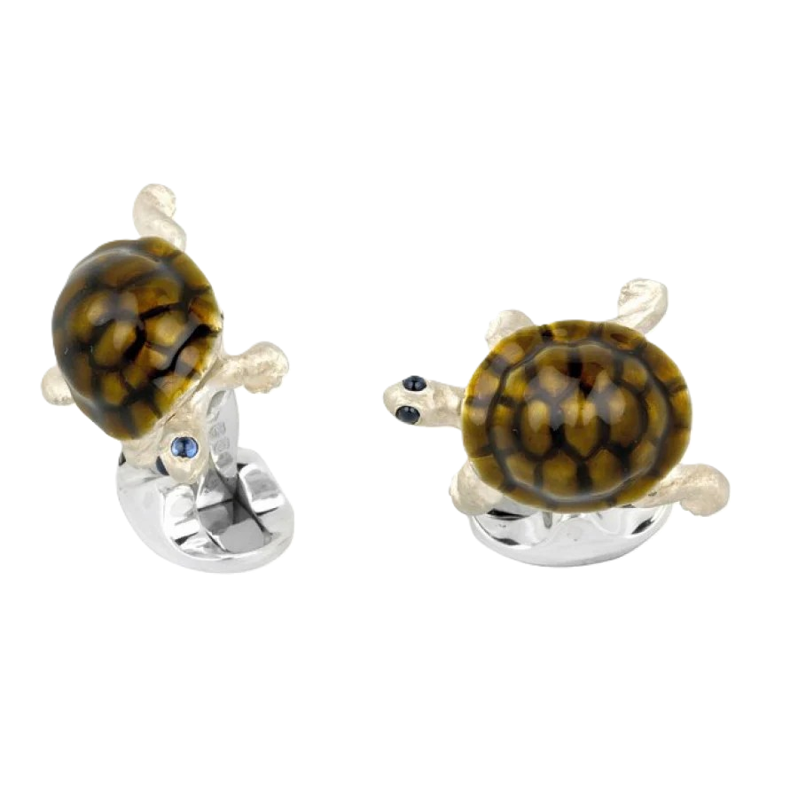 Sterling silver tortoise cufflinks with vitreous enamel shells and sapphire‑set eyes displayed as a matching pair on a clean white background.