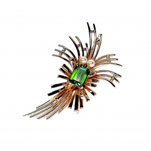 A step-cut green tourmaline with two delicate pearls set in a spray designed gold brooch.