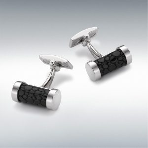 "Exquisite craftsmanship: Shagreen embossed black leather and sterling silver cylindrical cufflinks, a sophisticated accessory for the modern gentleman."