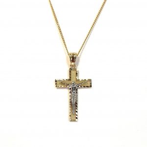 A yellow gold cross with an intricate white gold Jesus & a chris cross matt background with a contrasting sparkling diamond cut patterned edging.