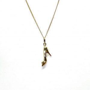 Ordsall 9ct Gold Shoe Necklace CMP00296: A refined 9ct gold pendant and chain delicately crafted in the shape of a high heel. Lightweight and versatile, perfect for everyday elegance.