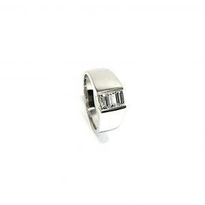 950 Platinum signet style ring set with three baguette diamonds in a landscape rub-over setting, showing at a 45% angle