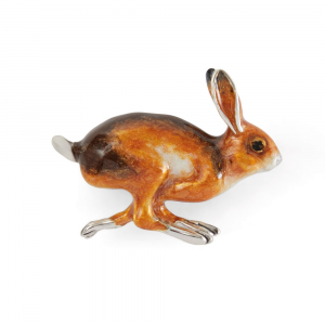 Close-up: Detailed view of the running hare brooch, showing rich brown enamel and textured sterling silver, with poised legs and ears mid-motion.