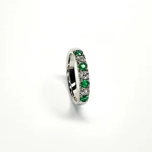 18ct White Gold Emerald & Diamond Eternity Ring RA00685 Four 2.8mm round emeralds and three 2.8mm round diamonds ring standing up to the front angled facing to the right. With a white background.
