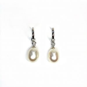 18ct white gold polished huggie loop/hoop earrings leading to a single round diamond and then onto  a single oval pearl drop.