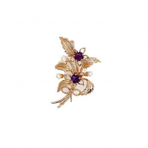 9ct rose gold flower brooch with five leaves, two round purple amethyst stones and three pearls made into a bouquet and tied to the bottom with a small twisted gold bow. Front view.
