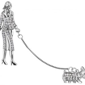 A real silver lady walking a dog on a chain leash brooch set with cubic zirconia with two pins.