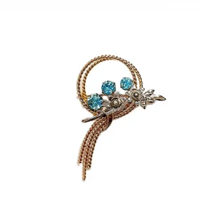 Handmade 9ct yellow and white gold brooch with a bouquet-inspired twisted wire design.